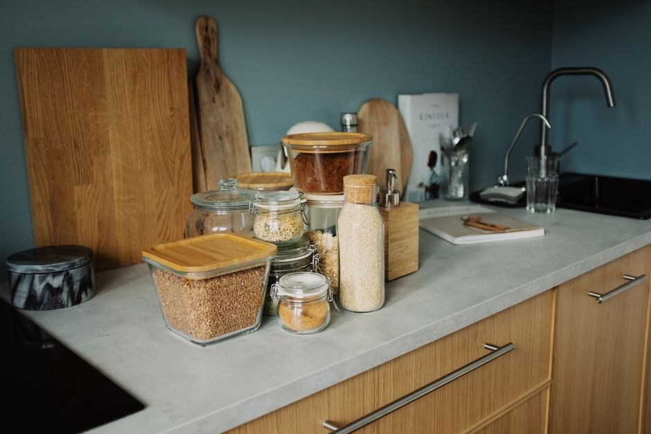 Tidy kitchen counter with jars and everyday cooking essentials.